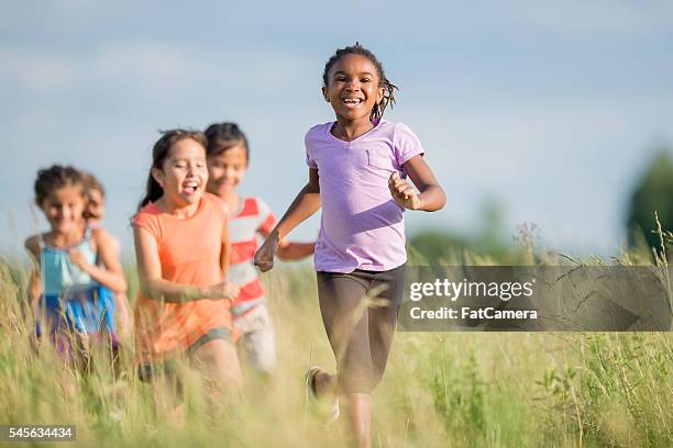 Chamsig Girls Chasing Each Other Outdoors Photos and Premium High Res Pictures ...