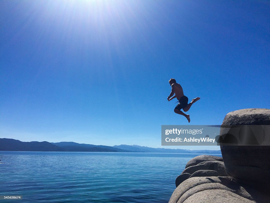 Man cliff jumping into Lake Tahoe