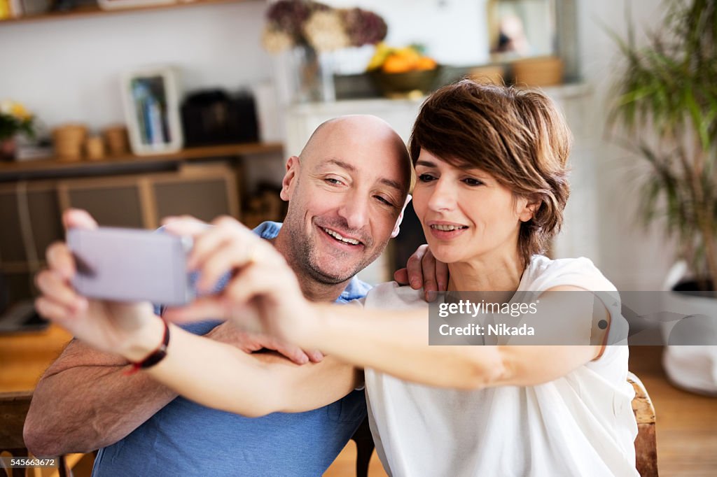 Couple posing for a selfie at home