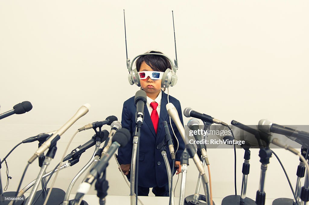 Young Japanese Boy with Headset and Microphones