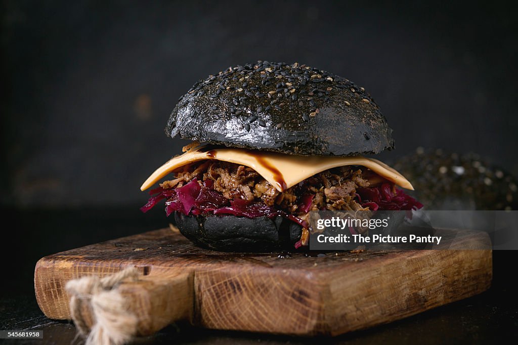 Black burger with stews