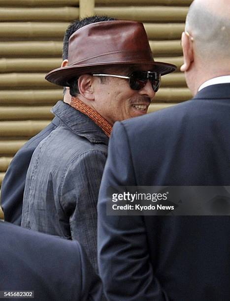 Japan - Kenichi Shinoda , the head of Yamaguchi-gumi, Japan's largest crime syndicate, arrives at the head office of the group in Kobe, after being...