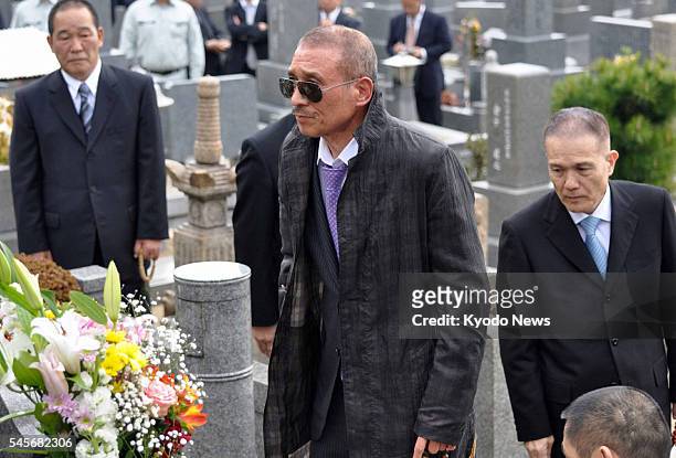 Japan - Kenichi Shinoda , the head of Yamaguchi-gumi, Japan's largest crime syndicate, visits a grave in Kobe, after being released from prison in...
