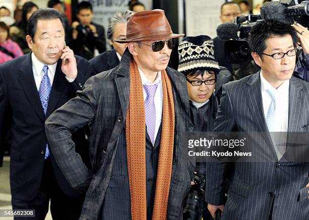 Japan - Kenichi Shinoda , the head of Yamaguchi-gumi, Japan's largest crime syndicate, arrives at a train station in Kobe city, where the group's...