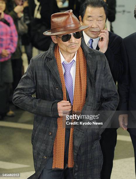 Japan - Kenichi Shinoda, the head of Yamaguchi-gumi, Japan's largest crime syndicate, arrives at a train station in Kobe city, where the group's...