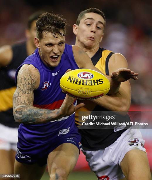 Clay Smith of the Bulldogs and Jason Castagna of the Tigers compete for the ball during the 2016 AFL Round 16 match between the Western Bulldogs and...