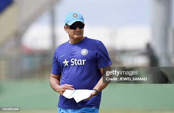 Indian cricket team head coach Anil Kumble watches his team before the start of a tour match between India and WICB President's XI squad at the...