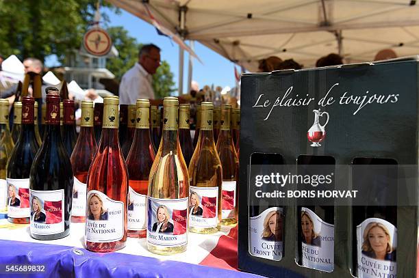 People sell wine bottles with a label picturing French far-right party Front National President and member of the European Parliament Marine Le Pen...