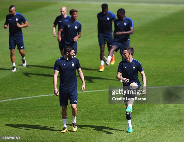 Andre-Pierre Gignac and Laurent Koscielny in discussion during a France training session on the eve of the UEFA EURO 2016 Final against Portugal at...