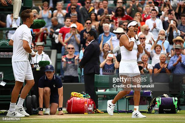 Heather Watson of Great Britain and Henri Kontinen of Finland celebrate victory during the Mixed Doubles Semi Finals match against Oliver Marach of...