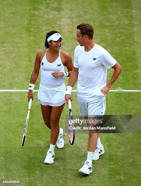 Heather Watson of Great Britain and Henri Kontinen of Finland in conversation during the Mixed Doubles Semi Finals match against Oliver Marach of...