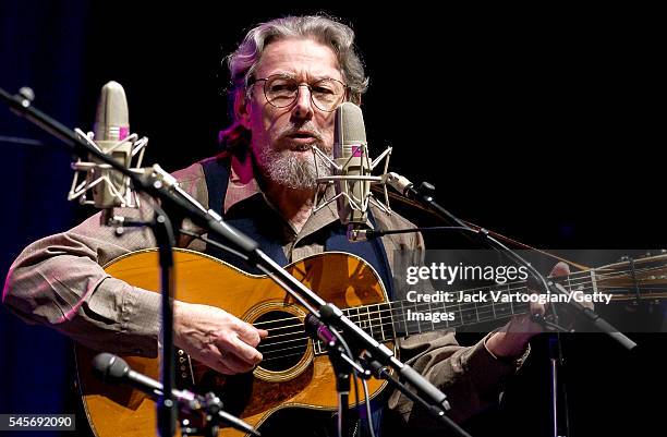 American Folk, Country and Bluegrass musician Norman Blake plays guitar as he performs onstage, during the 'Great High Mountain Tour,' at the Beacon...