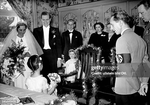 Joseph Goebbels on the occasion of his sisters marriage, his sister Maria and her husband, film director Max Kimmich, getting flowers from Goebbels'...