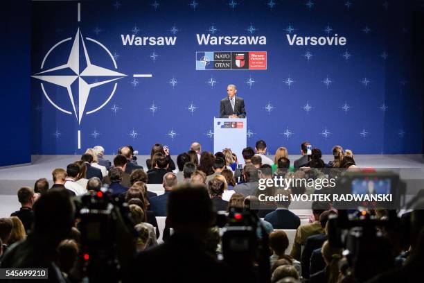 President Barack Obama attends a press conference during the second day of the NATO Summit at the Polish National Stadium in Warsaw on July 9, 2016....