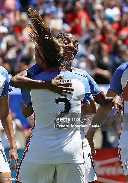 Crystal Dunn of the United States gets a hug from teammate Mallory Pugh after scoring a goal against South Africa during a friendly match at Soldier...