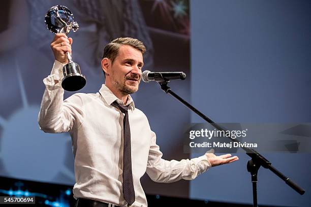 Director and actor Szabolcs Hajdu of Hungary delivers his speech after receiving the Crystal Globe Award for best actor in the film It's Not the Time...