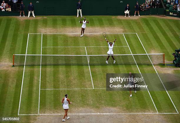 Venus Williams of The United States and Serena Williams of The United States celebrate victory in the Ladies Doubles Final against Timea Babos of...