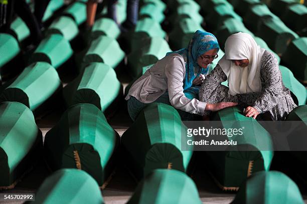 The relatives of 127 people who died during the Srebrenica Massacre mourn in Patacori, Bosnia and Herzegovina on July 9, 2016. Trucks carrying the...