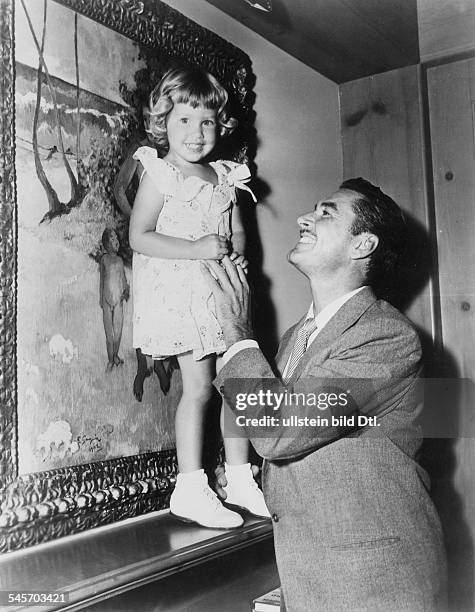 Flynn, Errol *-+Actor, Australiawith his daughter Rory.- about 1953
