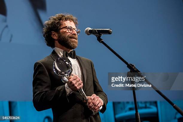 Screenwriter, producer and director Charlie Kaufman delivers his speech after receiving the Festival President's Award at the closing ceremony of the...
