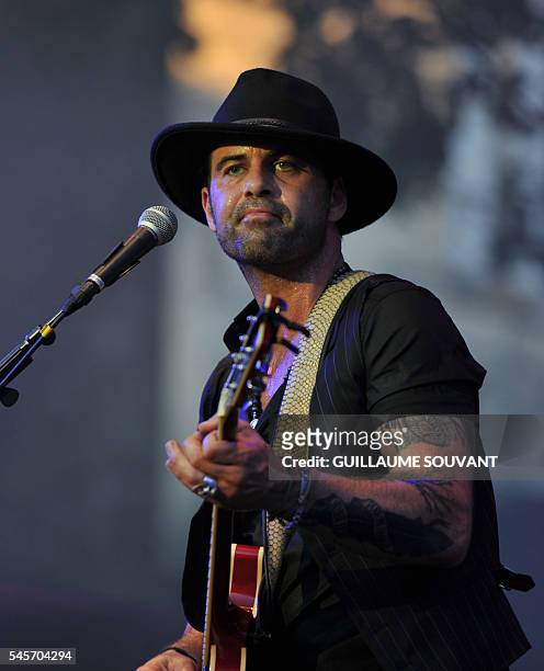 French singer and guitarist Manu Lanvin performs on stage during the 23rd edition of the Cognac Blues Passion festival in Cognac on July 09, 2016. /...