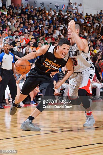 Devin Booker of the Phoenix Suns shakes handles the ball against the Portland Trail Blazers during the 2016 NBA Las Vegas Summer League game on July...