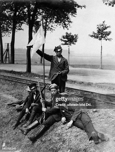 Silesian Uprising 1921 / Polish militia: Polish members of the militia holding the national symbol, the flag with the white eagle; in the near of...