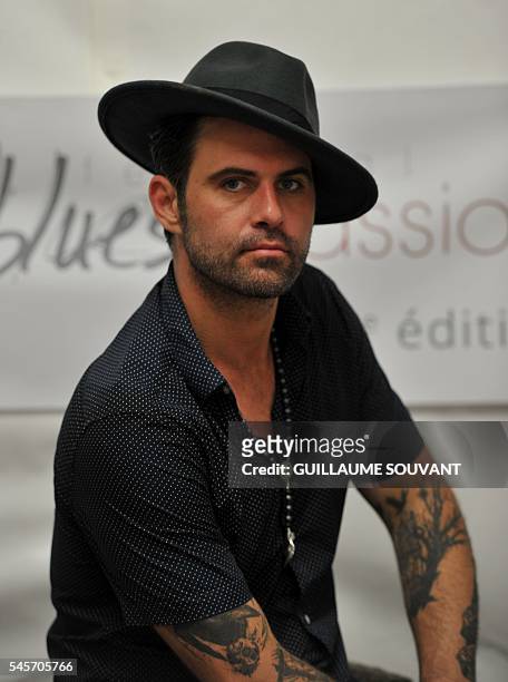French singer and guitarist Manu Lanvin poses during the 23rd edition of the Cognac Blues Passion festival in Cognac on July 9, 2016. / AFP /...