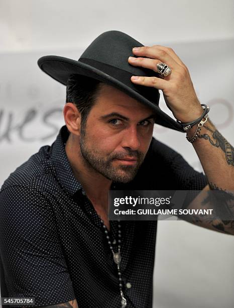 French singer and guitarist Manu Lanvin poses during the 23rd edition of the Cognac Blues Passion festival in Cognac on July 9, 2016. / AFP /...