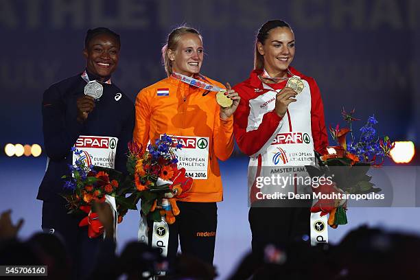 Nana Djimou of France, Anouk Vetter of The Netherlands and Ivona Dadic of Austria on the podium after receiving their medals for the womens...