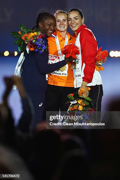 Nana Djimou of France, Anouk Vetter of The Netherlands and Ivona Dadic of Austria on the podium after receiving their medals for the womens...
