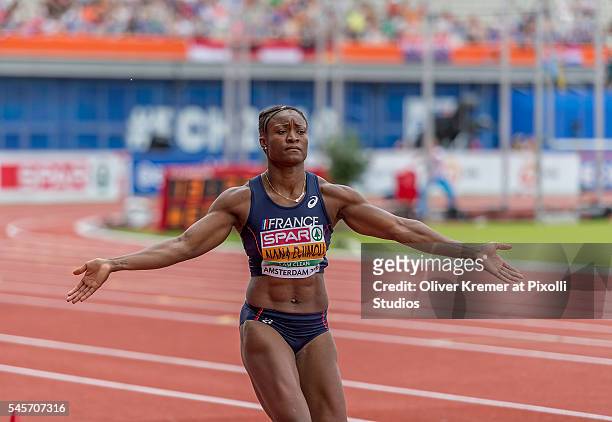 Antoinette Nana Djimou of France animating the audience to support her during the long jump of the women's heptathlon finals at the Olympic Stadium...