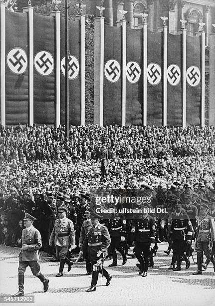 German Empire, celebrating the 1st of May, main manifestaion in the Berlin Lustgarten, Hitler walking to the honoury stand, in his entourage, from...