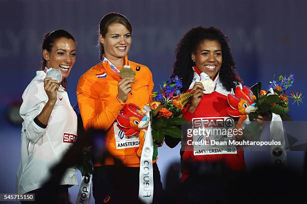 Ivet Lalova-Collio of Portugal , Dafne Schippers of The Netherlands and Mujinga Kambundi of Switzerland pose on the podium after receiving their...