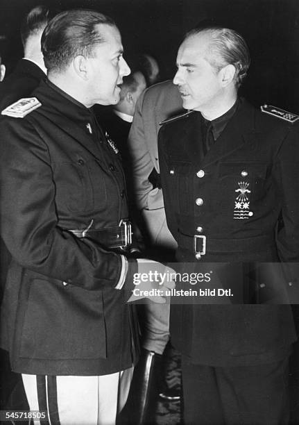 Reception in honour of the foreign delegations in the Hotel 'Kaiserhof' in Berlin: Italian foreign minister Count Galeazzo Ciano talking to his...