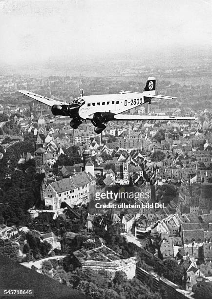 Germany, Third Reich - Nuremberg Rally 1934 Adolf Hitler's airplane, a 'Ju 52', on its landing approach over Nuremberg
