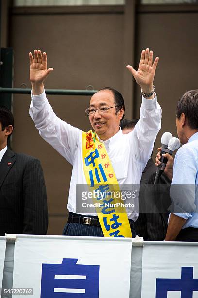 Masaharu Nakagawa a candidate from Liberal Democratic Party greets supporters during the last day of 2016 Upper House election campaign outside of...