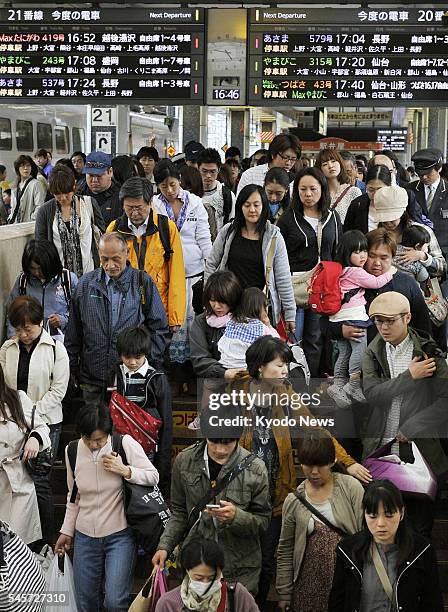 Japan - JR Tokyo Station is crowded with travelers on May 5 many of whom are on the way home after spending their ''Golden Week'' holidays away. The...