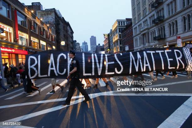 Police officer patrols during a protest in support of the Black lives matter movement in New York on July 09, 2016. - The gunman behind a...