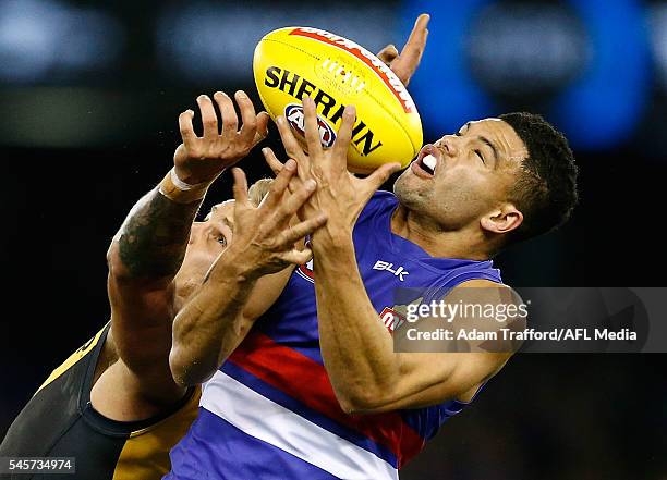 Brandon Ellis of the Tigers and Jason Johannisen of the Bulldogs compete for the ball during the 2016 AFL Round 16 match between the Western Bulldogs...