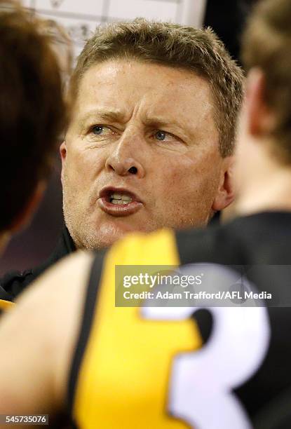 Damien Hardwick, Senior Coach of the Tigers addresses his players during the 2016 AFL Round 16 match between the Western Bulldogs and the Richmond...
