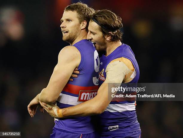 Jake Stringer of the Bulldogs celebrates a goal with Marcus Bontempelli of the Bulldogs during the 2016 AFL Round 16 match between the Western...