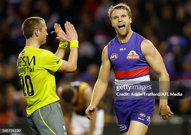 Jake Stringer of the Bulldogs celebrates a goal during the 2016 AFL Round 16 match between the Western Bulldogs and the Richmond Tigers at Etihad...