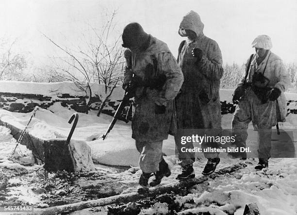 World War II Battle of the Bulge German soldiers are going to a changing of the guard at an advanced position - early January 1945