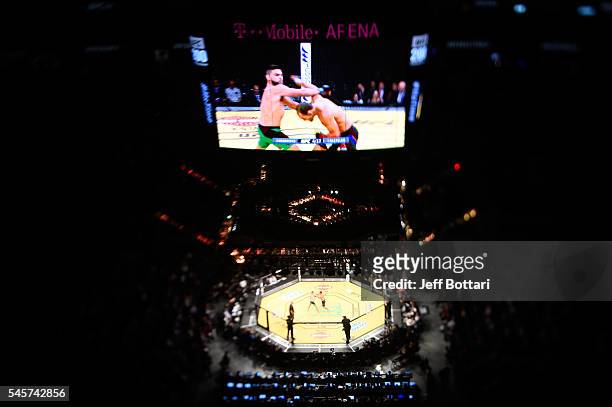 An overhead view of the Octagon as Johny Hendricks punches Kelvin Gastelum during the UFC 200 event on July 9, 2016 at T-Mobile Arena in Las Vegas,...