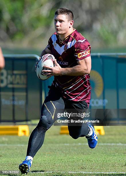 Jacob Lillyman runs with the ball during a Queensland Maroons State of Origin training session on July 10, 2016 at the Gold Coast, Australia.