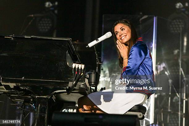 Christina Perri performs on Billy Joel's Piano as the opening act of the Billy Joel Show at Citizens Bank Park on July 9, 2016 in Philadelphia,...