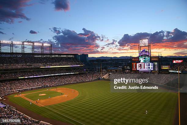 The sun sets over the stadium as the Philadelphia Phillies take on the Colorado Rockies at Coors Field on July 9, 2016 in Denver, Colorado.