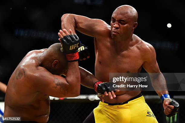 Anderson Silva of Brazil elbows Daniel Cormier in their light heavyweight bout during the UFC 200 event on July 9, 2016 at T-Mobile Arena in Las...