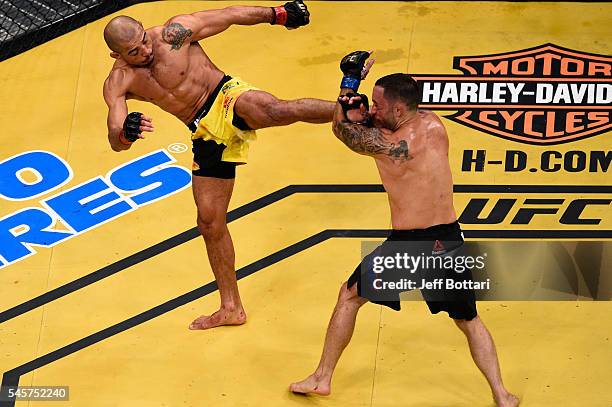 Jose Aldo of Brazil kicks Frankie Edgar during the UFC 200 event on July 9, 2016 at T-Mobile Arena in Las Vegas, Nevada.